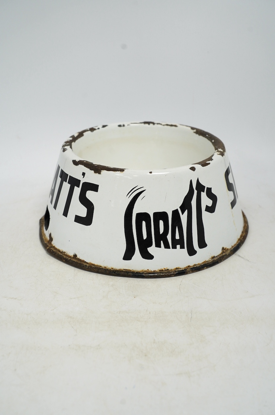 A vintage Spratt’s circular enamel advertising dog bowl, 27cm diameter, 10cm high. Condition - poor